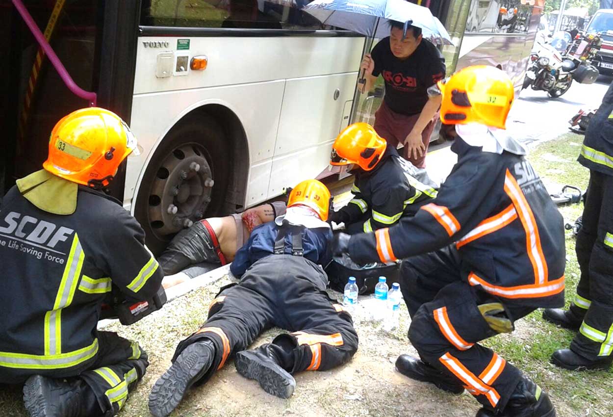 Man trapped under double-decker bus in accident on Hougang Avenue 9