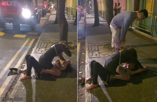 Two women in catfight at Clarke Quay - right in front of police vehicle