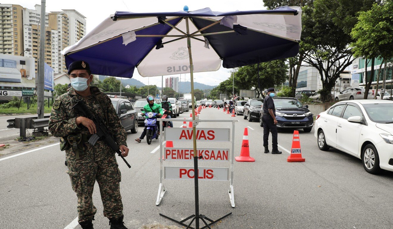 Quiet falls over Malaysia, with residents in lockdown ...