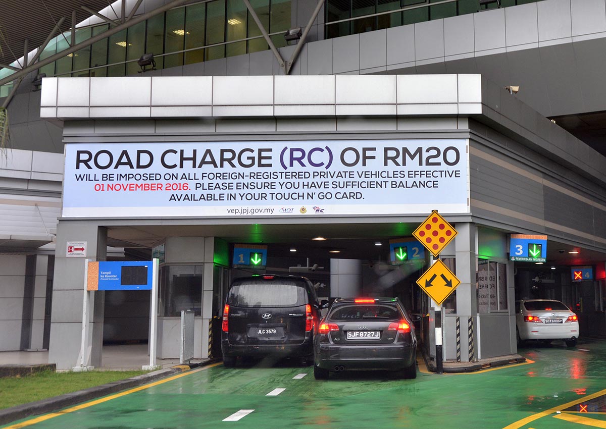 Singapore willing to lift road charge when Malaysia ...