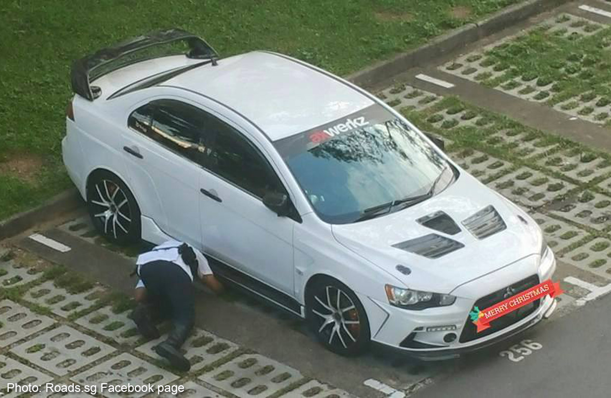 Photos of LTA officer inspecting car in carpark raise netizens' ire