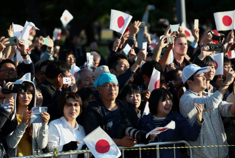 Cheering crowds greet Japan's new emperor in rare parade, Asia News