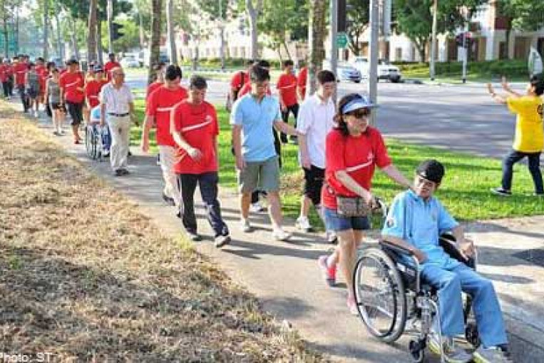 70,000 walkers pound the streets for a cause, Singapore News - AsiaOne