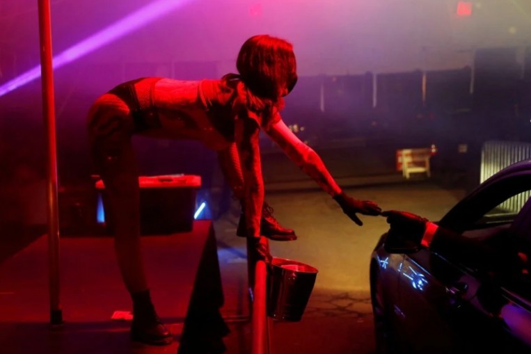 Strip show meets drive-through as pole dances for drivers offered by